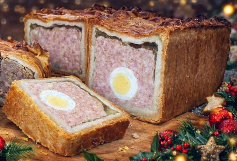 sliced gala pie showing the hard-boiled egg in the centre