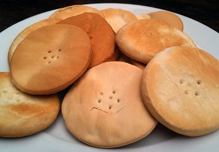 home-made galletti water biscuits arranged on a plate