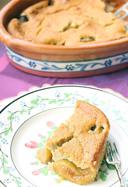 figs baked in a fonio flour batter with a slice presented on a plate