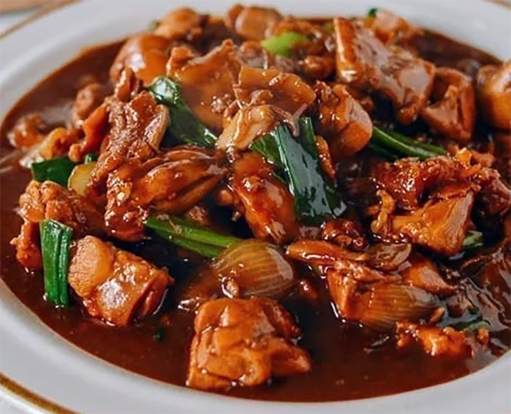 ginger chicken presented in a shallow bowl
