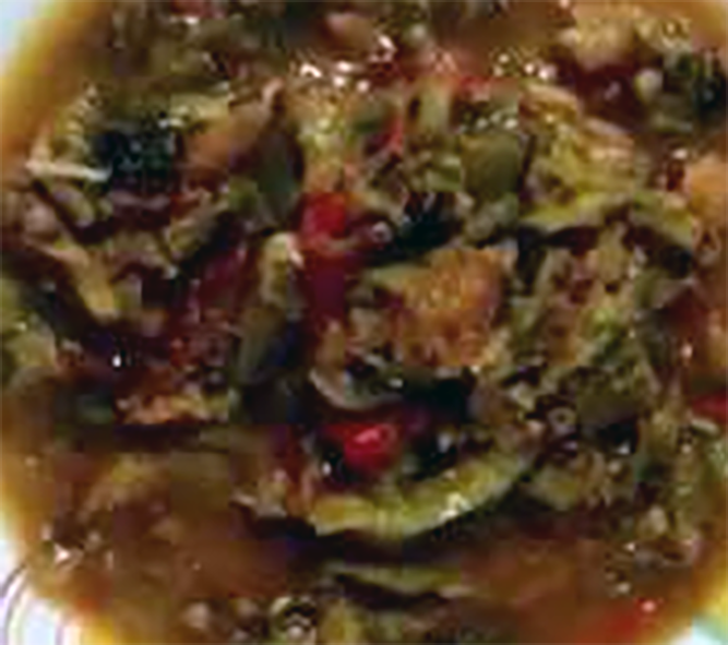 stew of dried fish in a tomato and onion base with okra powder served on a plate