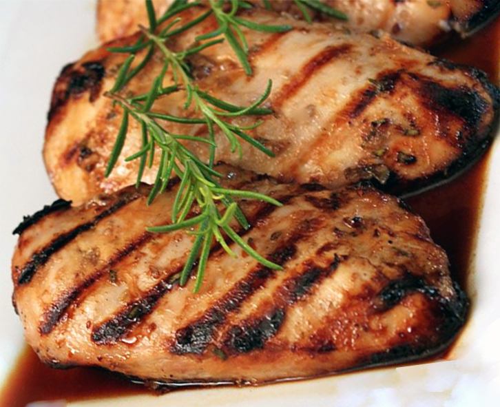 chicken breasts marinated in a stock, raspberry vinegar and lemon marinade that are barbecued to cook and served on a raspberry sauce