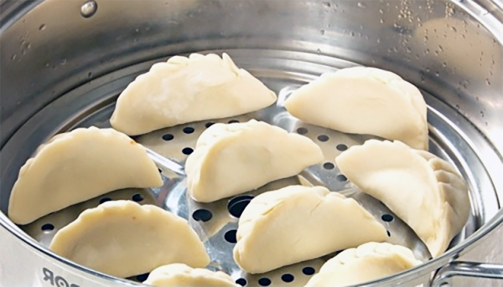 hot water dough dumplings in a steamer basket