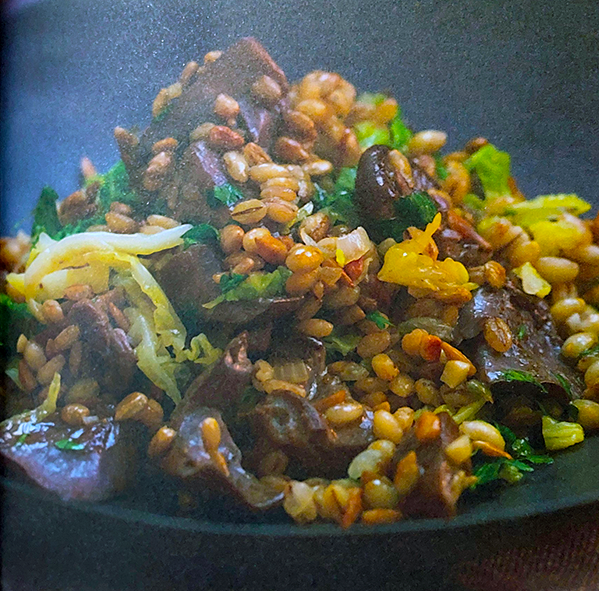 hot winter wood blewit salad with pearl barley piled on a plate
