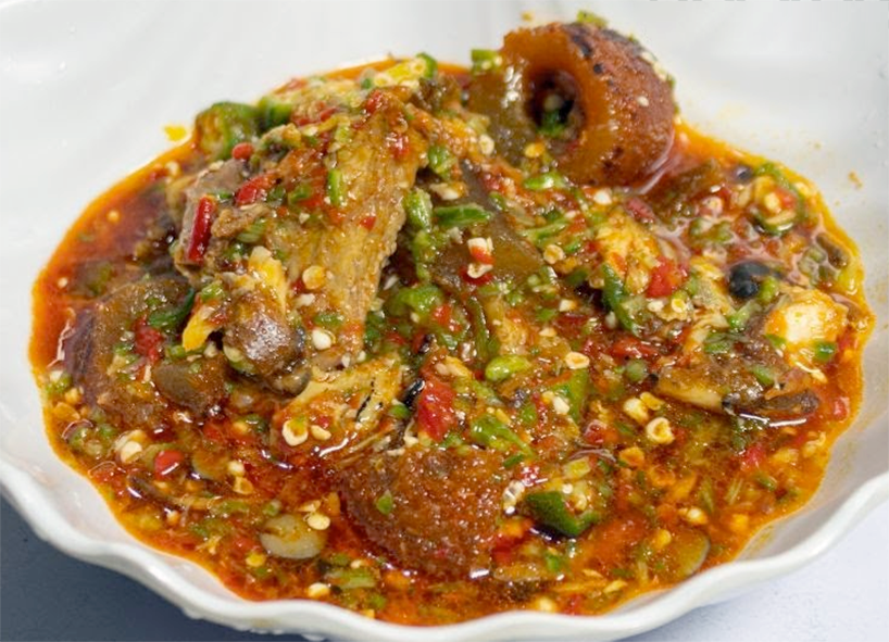 ila alasepo, Nigerian okra soup with mixed meat served in a white dish