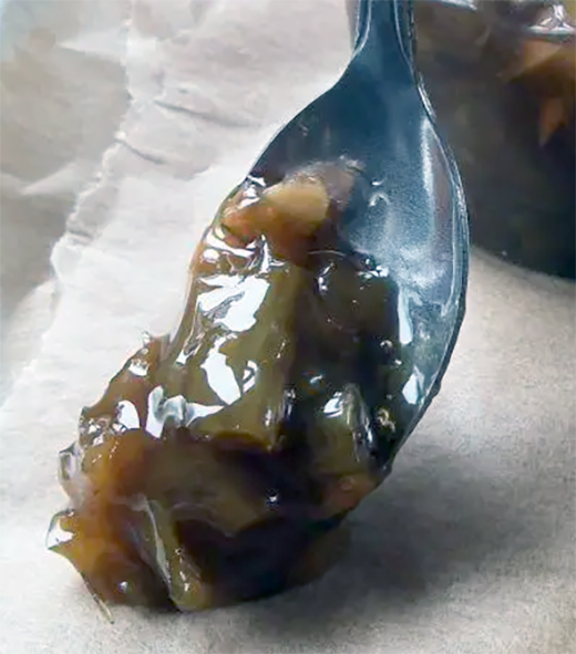 Japanese knotweed and ginger jam on a spoon