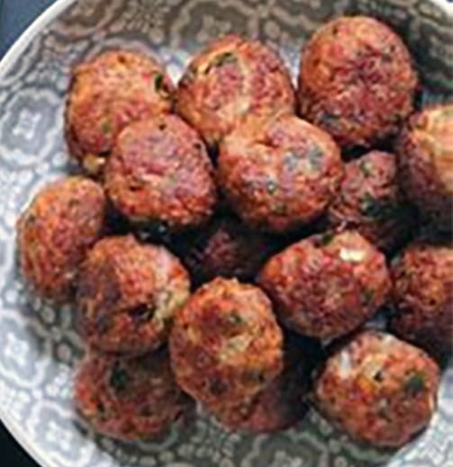 keftedhakia meatballs piled on a plate