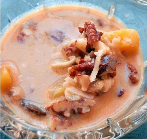 dried fruit and nut compote in a pumpkin base served in a glass bowl