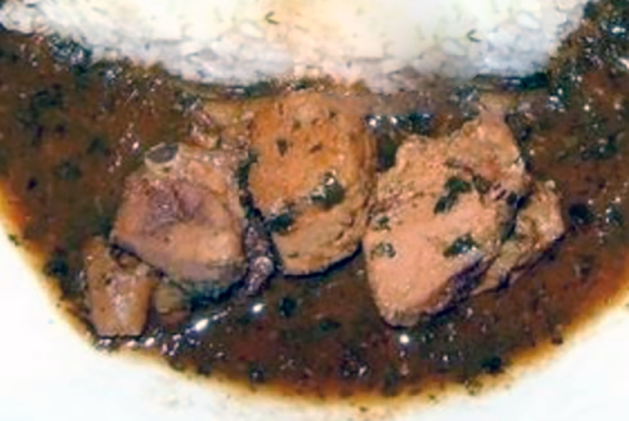 Ivorian kpala or jute leaf sauce served with rice