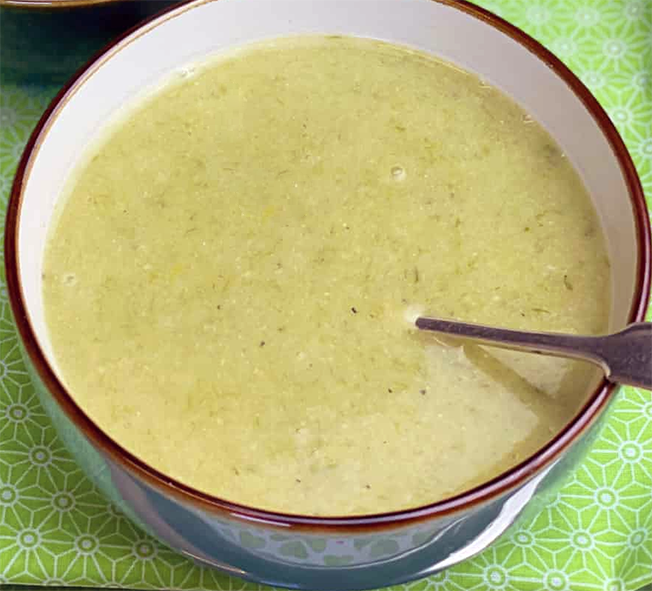 Brotchan roi, Irish leek and oatmeal soup in a soup bowl with a spoon