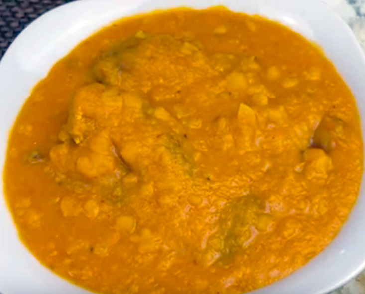 dish of split peas and fish served in a white bowl