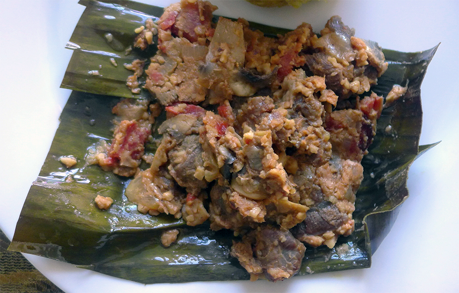 steamed beef in banana leaves served in the banana leaf