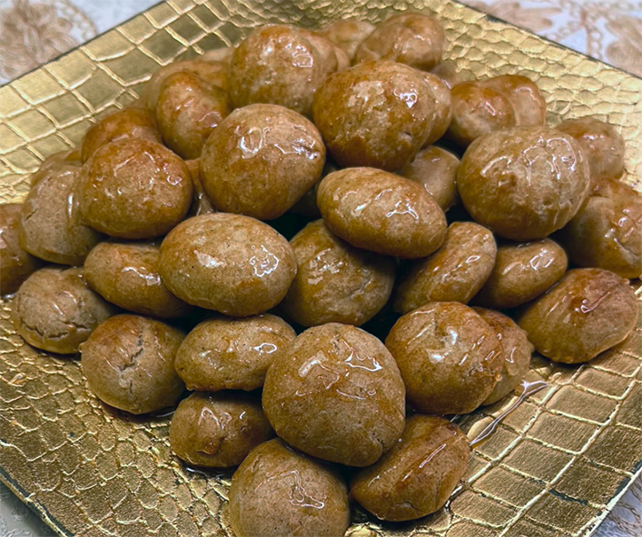 magshush piled into a pyramid on a golden plate