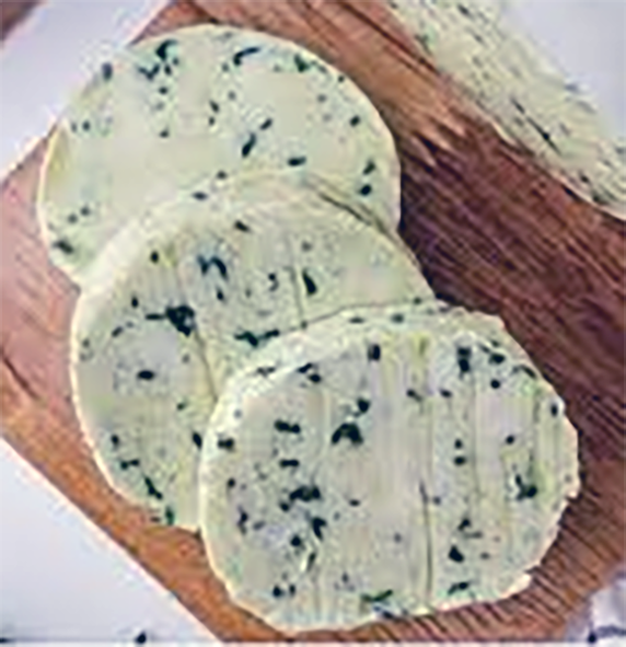 Rounds of maitre d'hotel butter on a chopping board