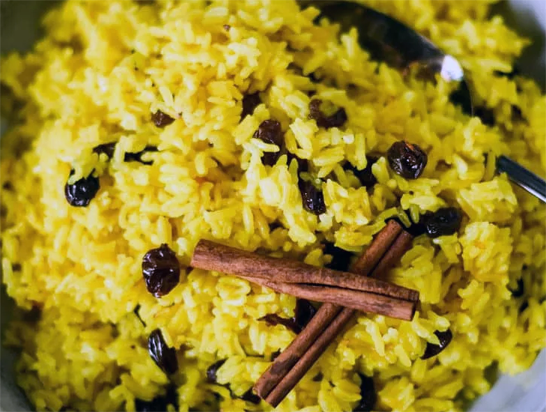 Malawi yellow rice with raisins and cinnamon sticks