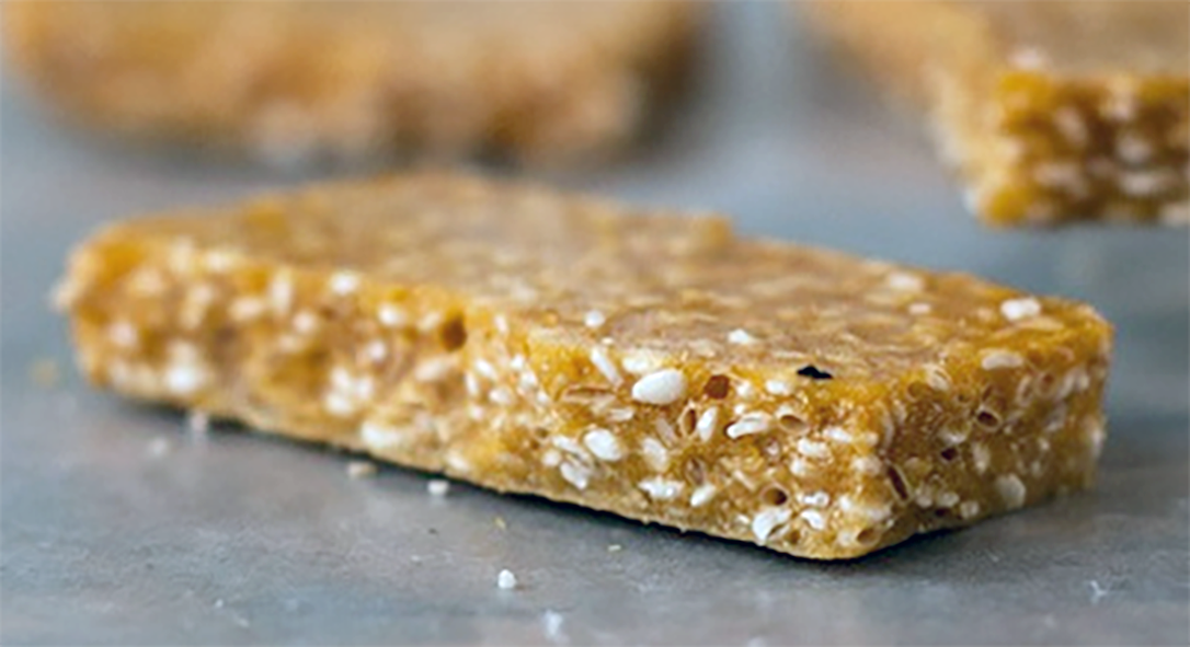 sesame seed and honey wafer on a work surface