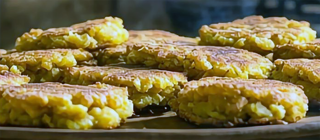 maize fritters on a large wooden plate