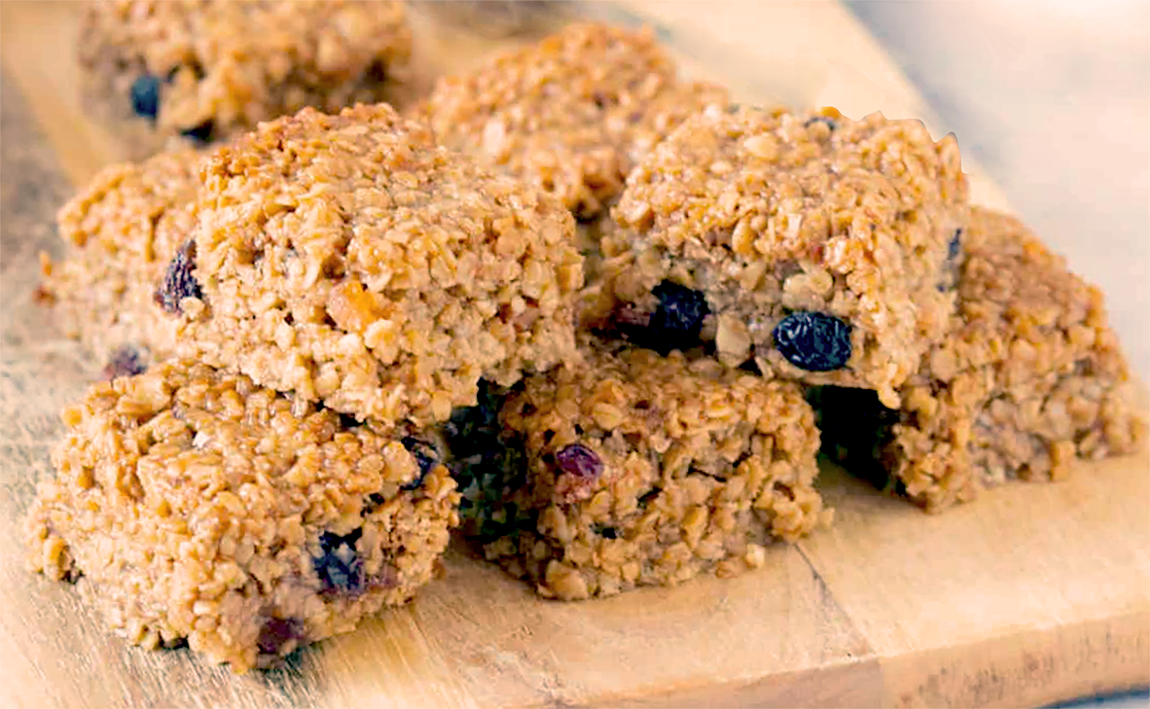 mincemeat flapjack squares arranged on a wooden cutting board
