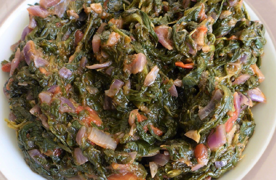 ombidi, Namibian spinach stew with onions served on a plate