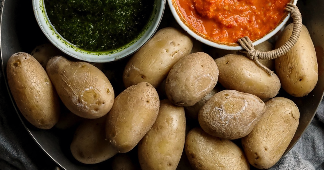 papas arrugadas, Canaries wrinkled potatoes in a steel dish with green and red sauces