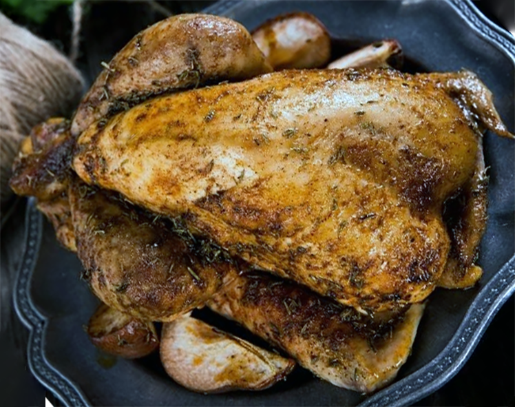 stuffed guineafowl on a metal serving dish