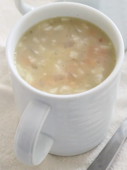 Plantain and coconut soup presented in a mug