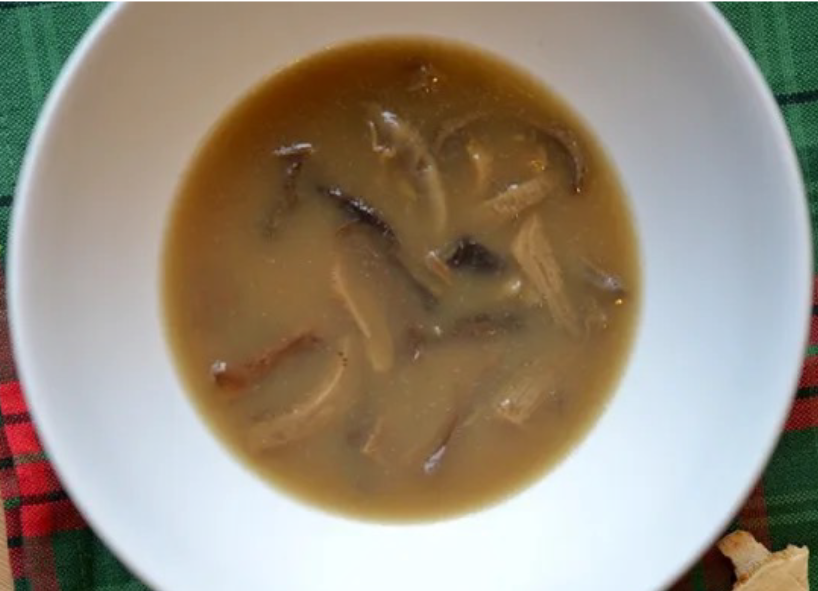 Polish Christmas mushroom soup presented in a white soup bowl