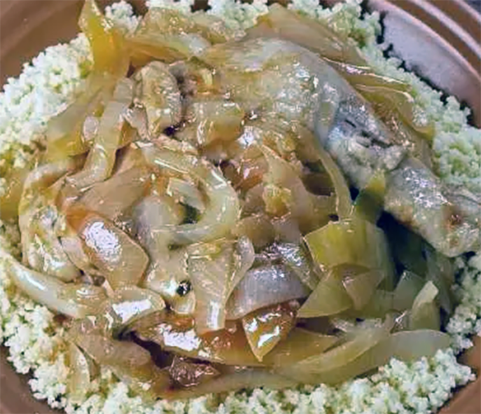 Mauritian chicken yassa served on a bed of couscous