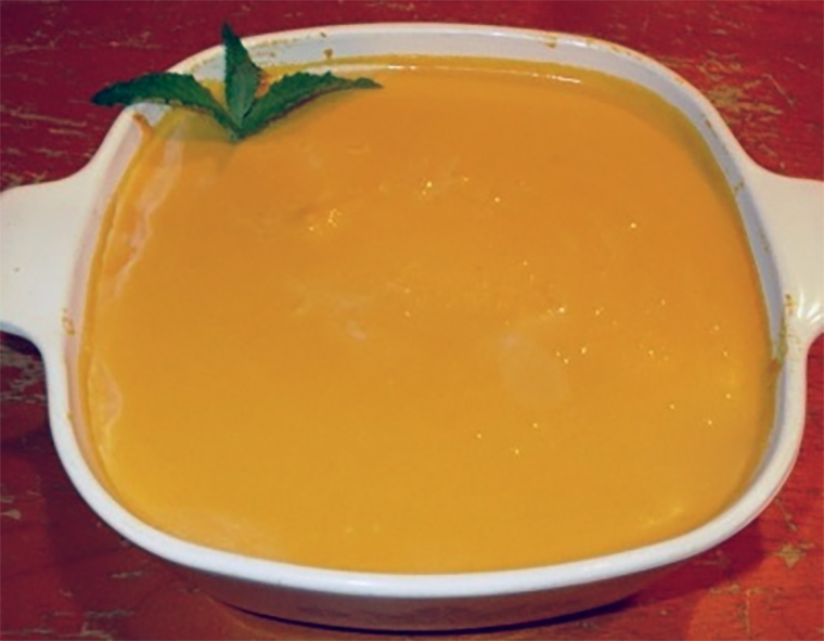sweet potato pudding with saffron set in a white baking dish