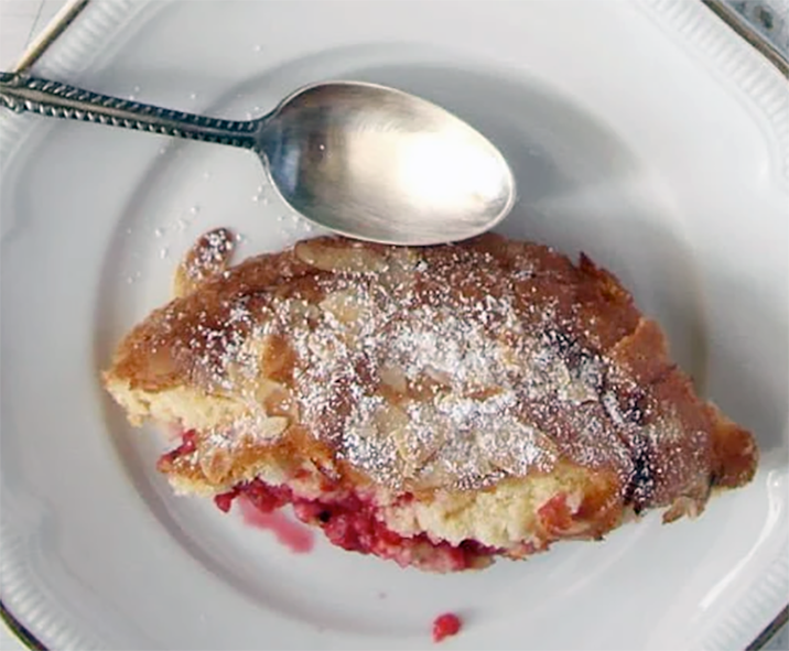 piece of redcurrant cobbler served on a plate with a spoon