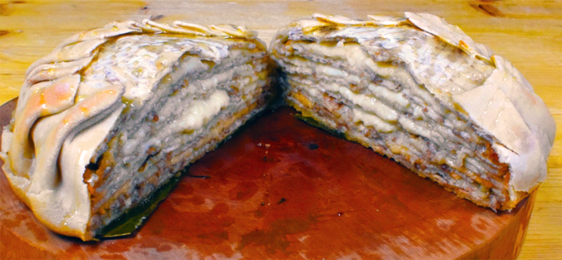 placenta, layered cheesecake split in half on a chopping board