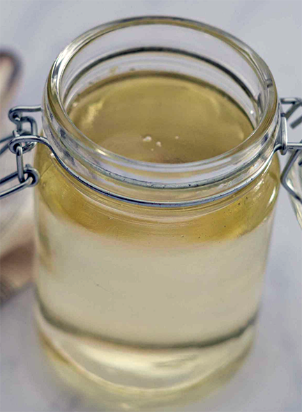 rose water attar/atter syrup in a flip-top jar
