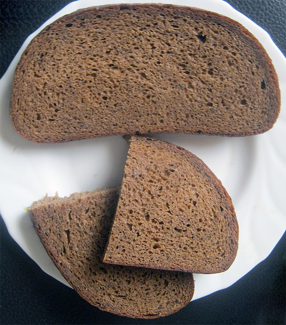 slices of rupjmaize, Latvian rye bread on a white plate