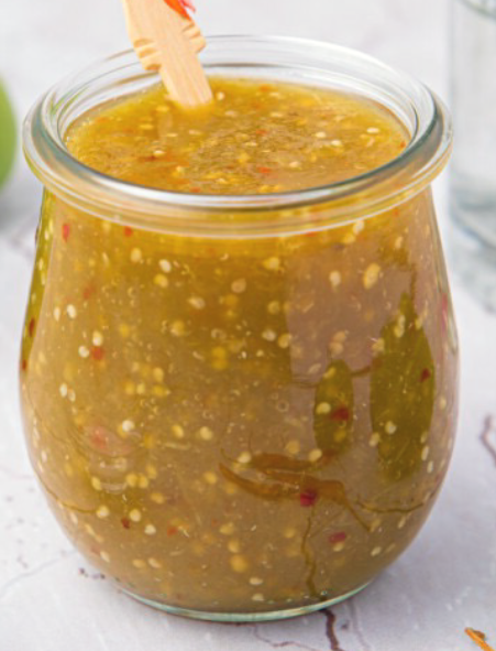 green tomatillo salsa in a glass jar