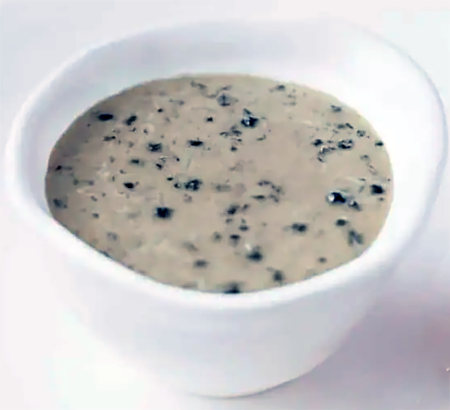 Sauce au poivre, French peppercorn sauce in a white ramekin