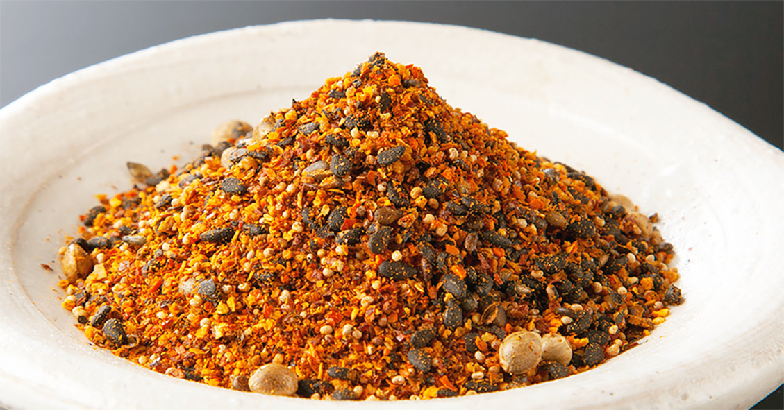 Shichimi Togarashi, Japanese Seven-spice Powder mounded on a small white dish