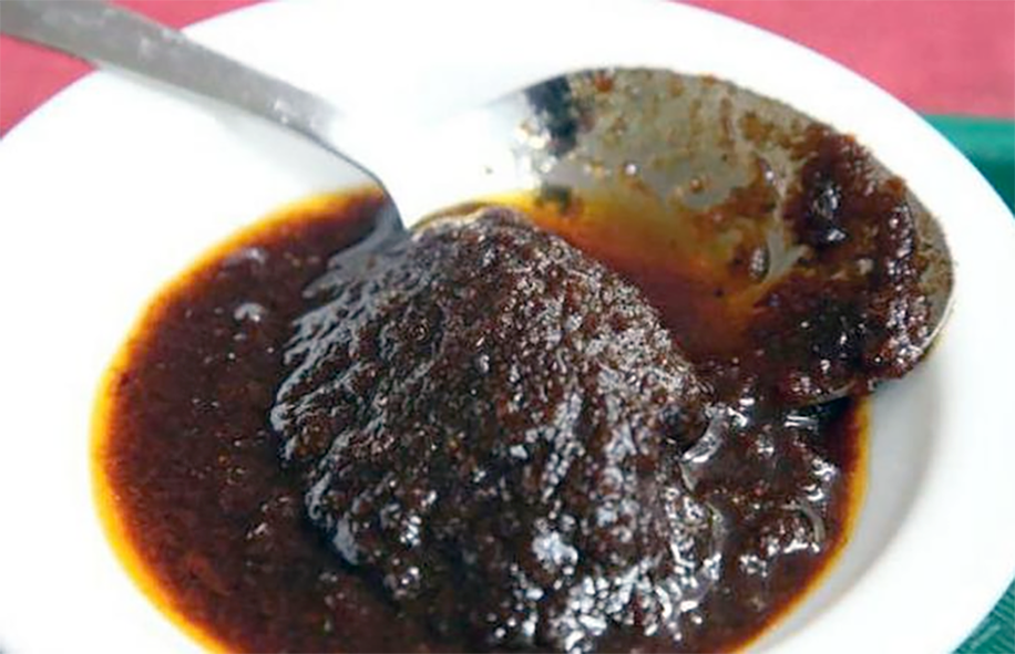 shito chilli sauce served in a dish with a spoon