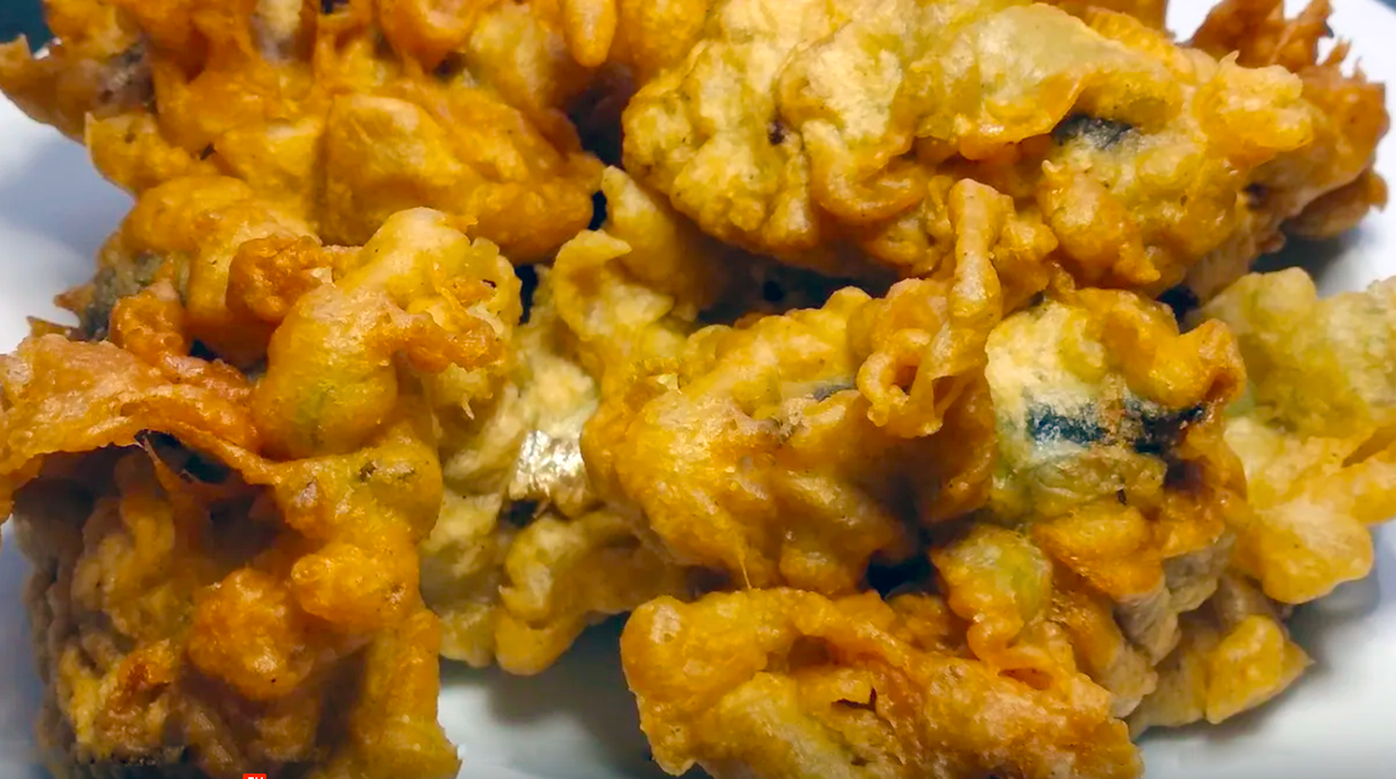 deep fried fish cakes from sierra leone arranged on a plate