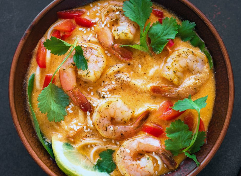 simple prawn laksa served in an earthenware bowl