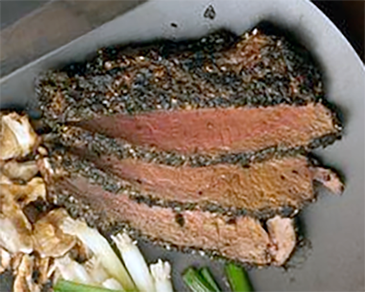 pan-seared wasabi crusted sirloin served with shiitake mushrooms, spring onions and wasabi