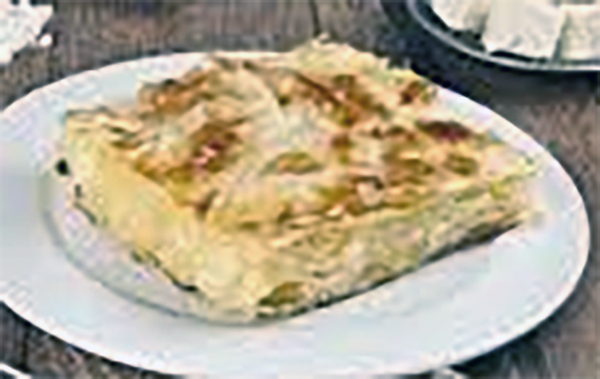 square of Armenian sou boerag showing the cheese filling inside