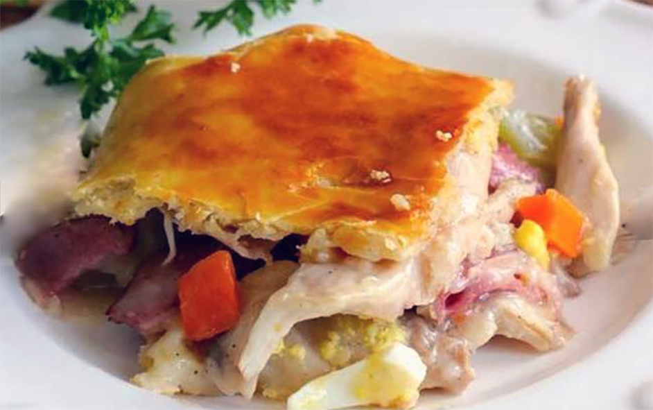 square of south african chicken pie on a white plate