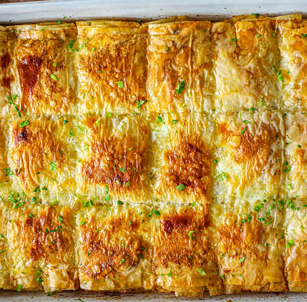 Spanagh-Banir Boerag, Cheese and Spinach Filo Bake divided into squares in a baking dish