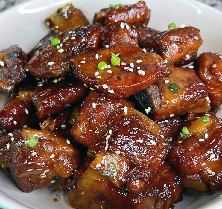 spare-ribs in sweet and sour sauce served mounded on a plate