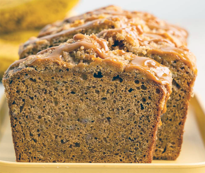 banana cake with dulce de leche icing served on a plastic tray