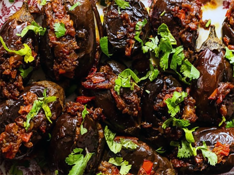 stuffed aubergines arranged on a plate