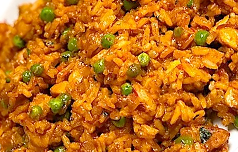 close-up of surinamese nasi goreng rice with peas served on a white plate