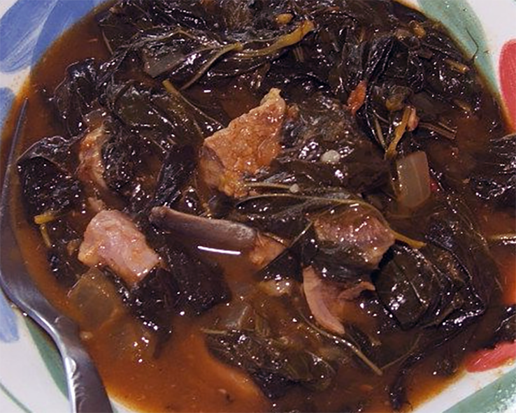 molohya, with jute mallow and chicken served in a bowl