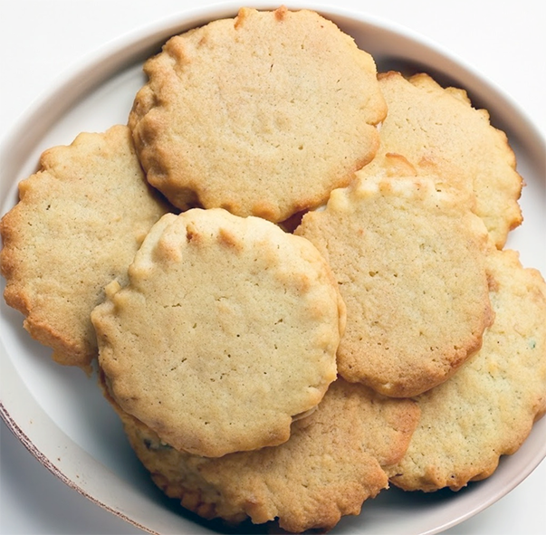 plain tea biscuits fanned out on a white plate