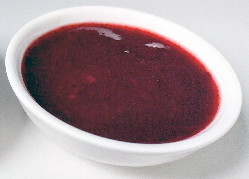 red tkemali (cherry plum) sauce served in a bowl